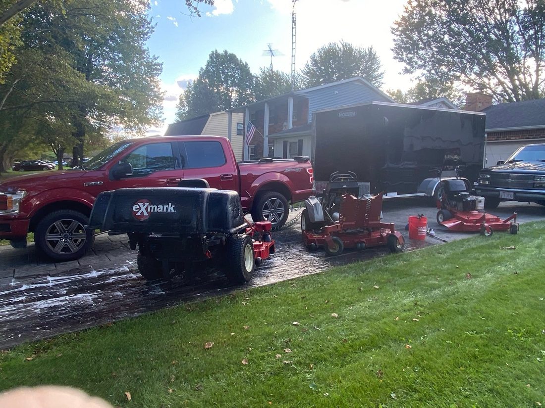 Crew truck and dump trailer loaded for haul-off